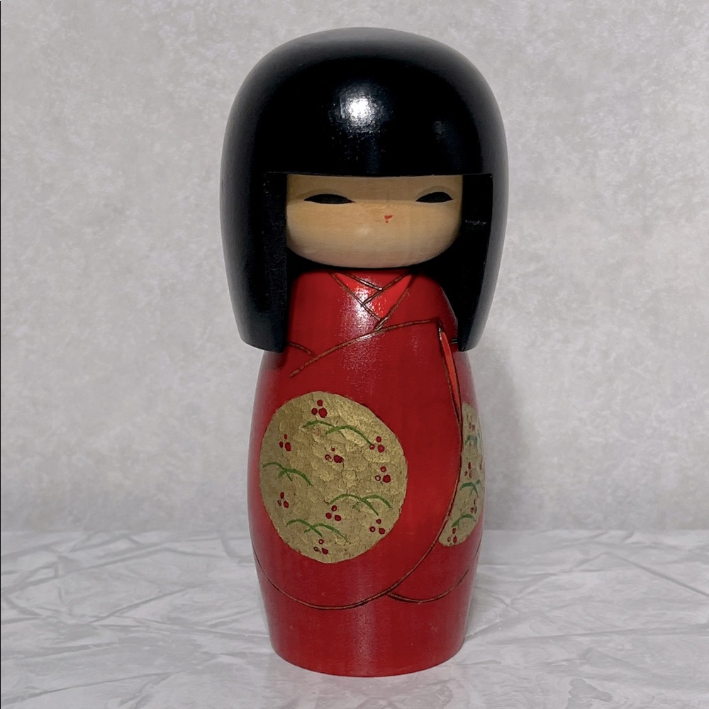 Charming Red Japanese Kokeshi Doll hand carved hand painted with gold accents
